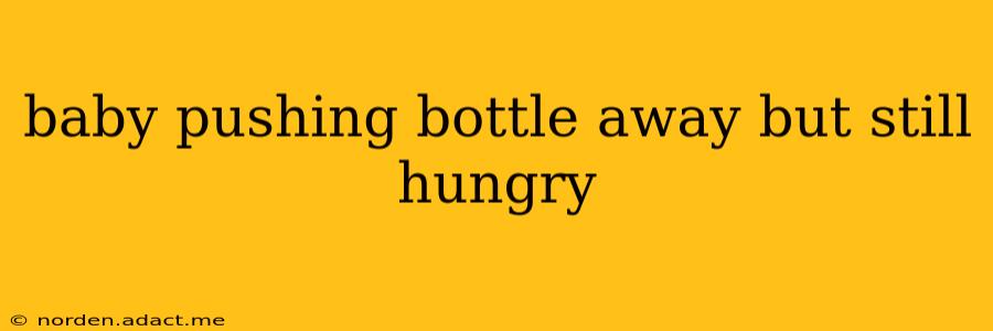 baby pushing bottle away but still hungry